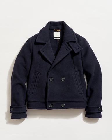 Navy peacoat on a light beige background