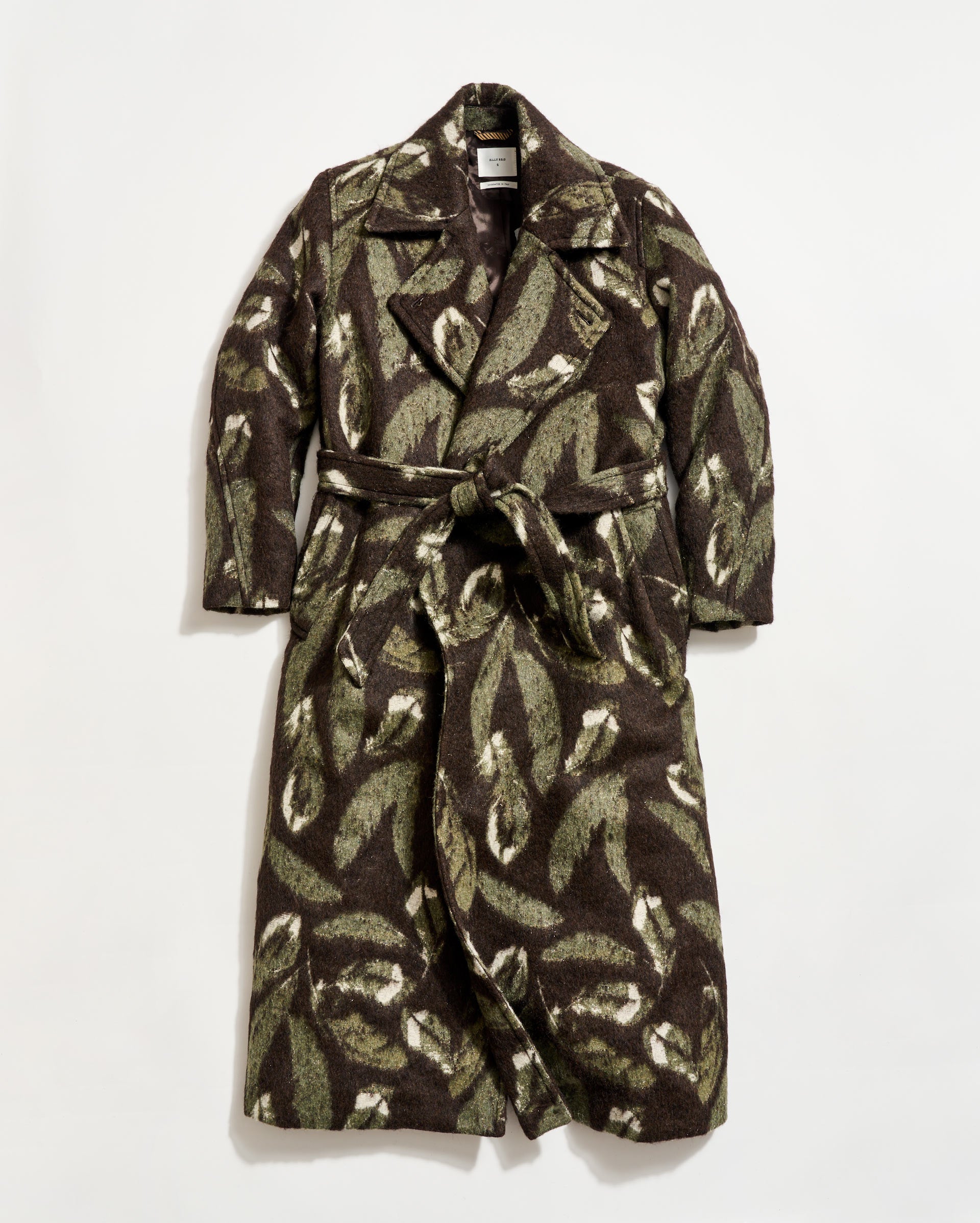 Camouflage-patterned coat on a white background