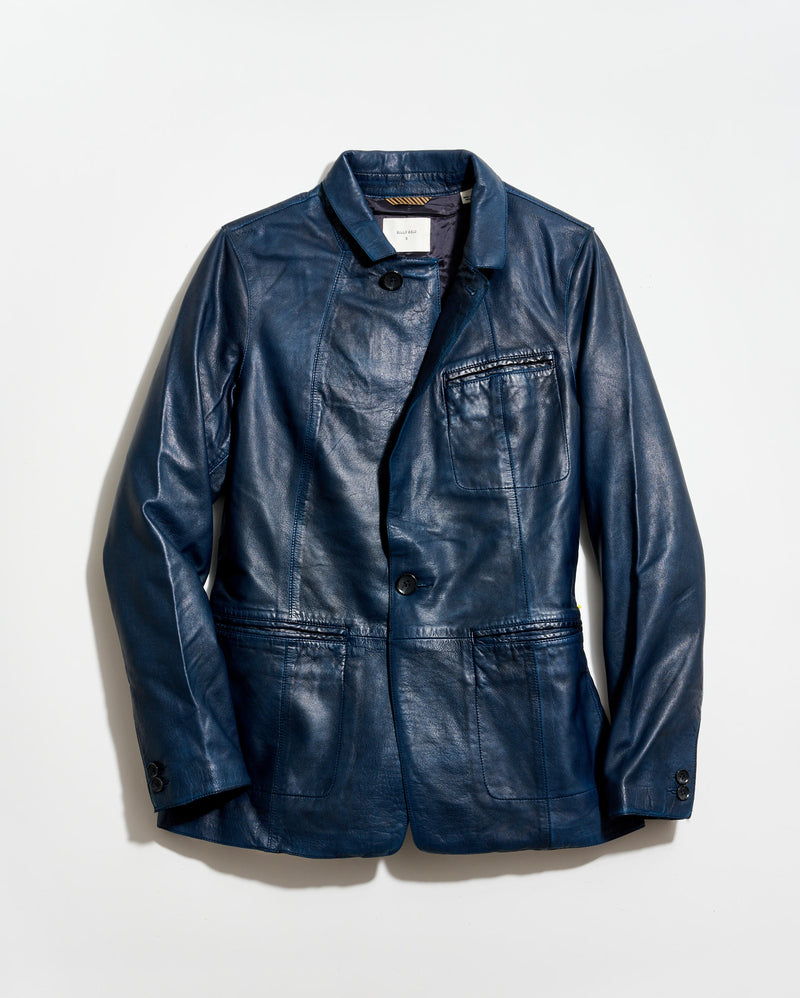 Blue leather jacket on a light gray background