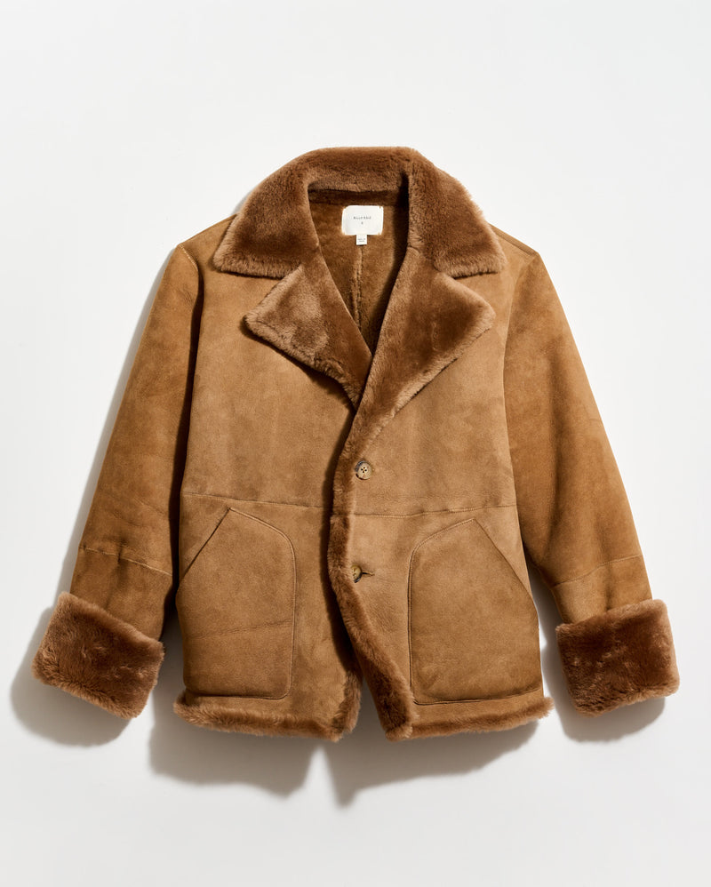 Brown shearling coat on a light gray background