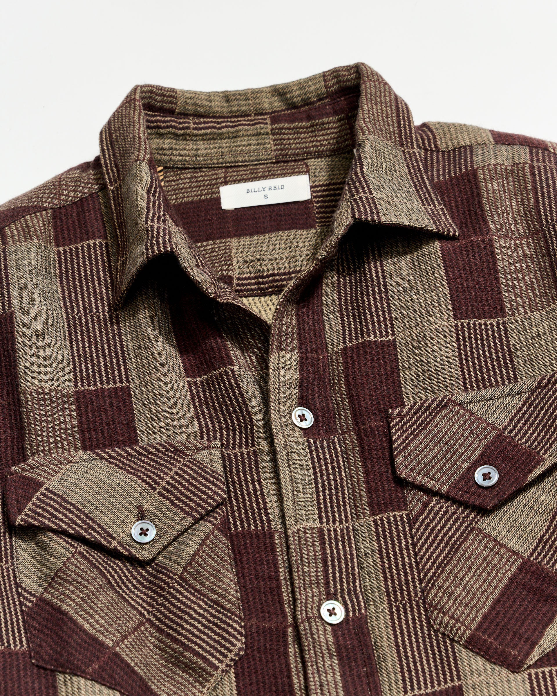 Plaid dress with a collar and buttons on a white background