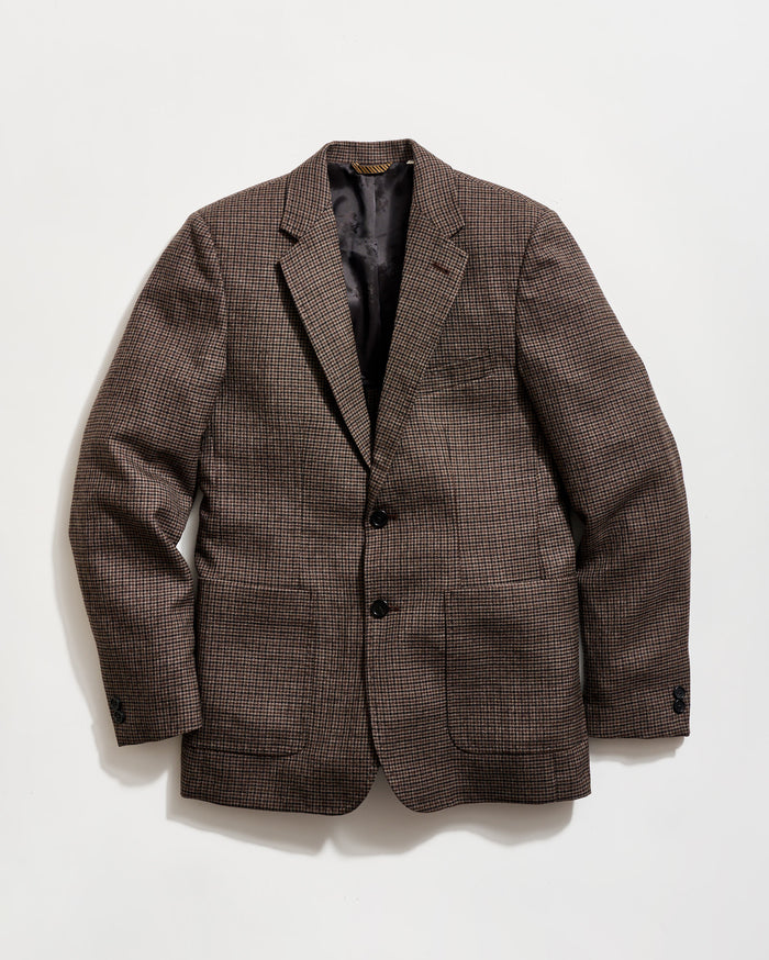 Brown checkered blazer on a light gray background