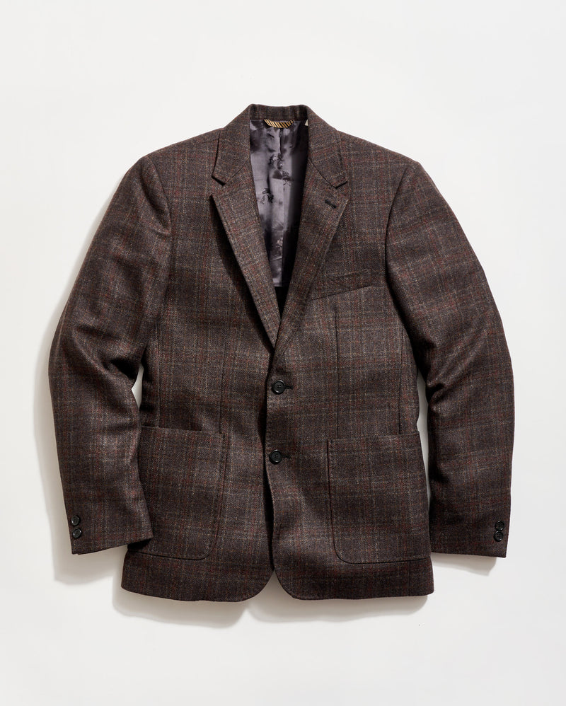 Brown checkered blazer on a light gray background