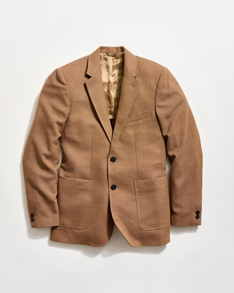 Brown blazer on a light beige background
