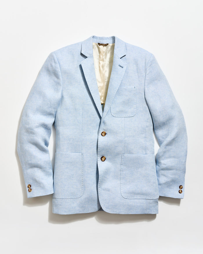 Light blue blazer with gold buttons on a white background