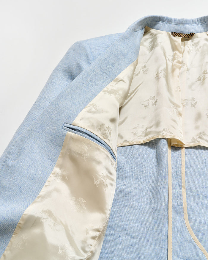 Light blue and beige fabric with a zipper on a light gray background