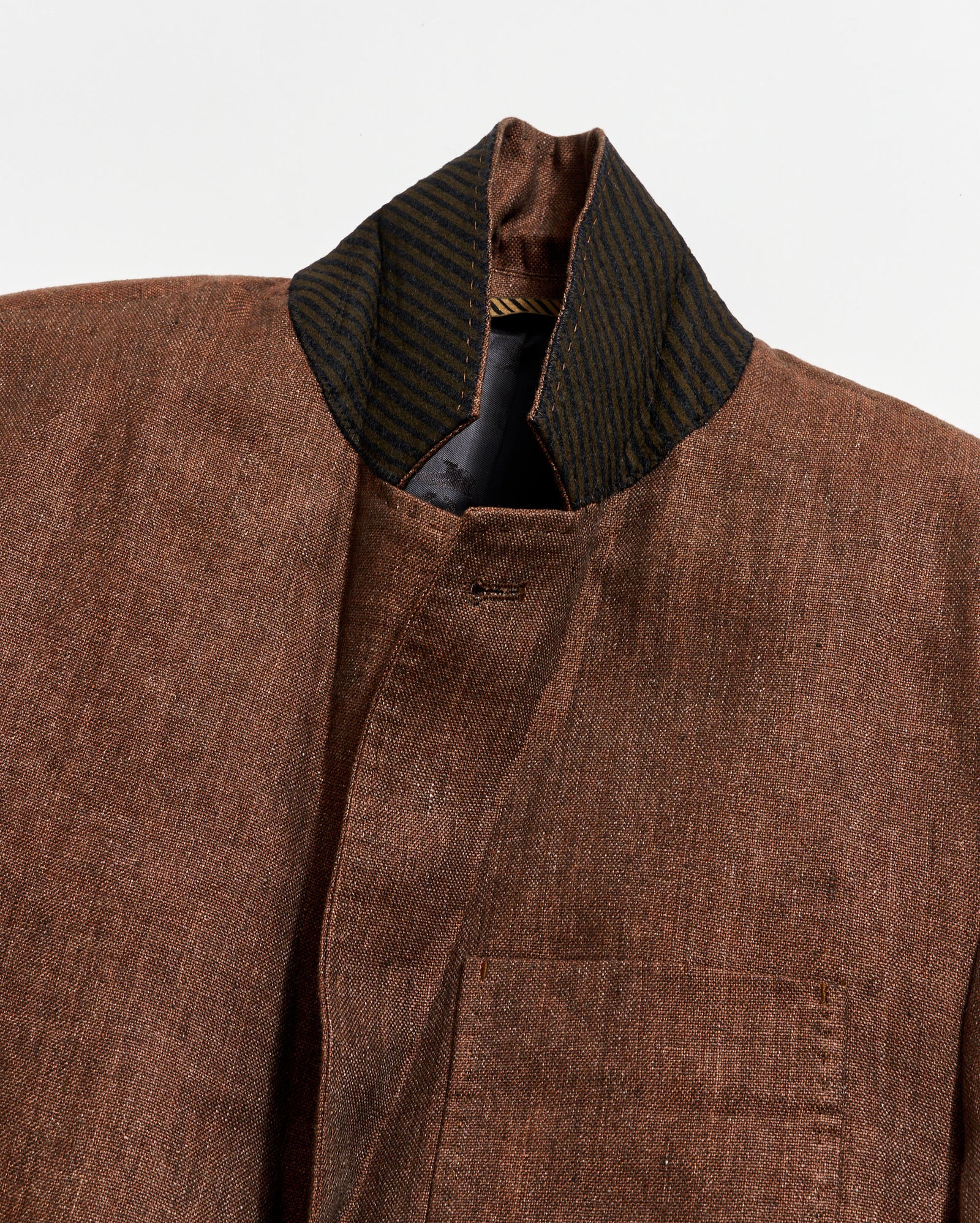 Brown textured jacket with a collar on a white background