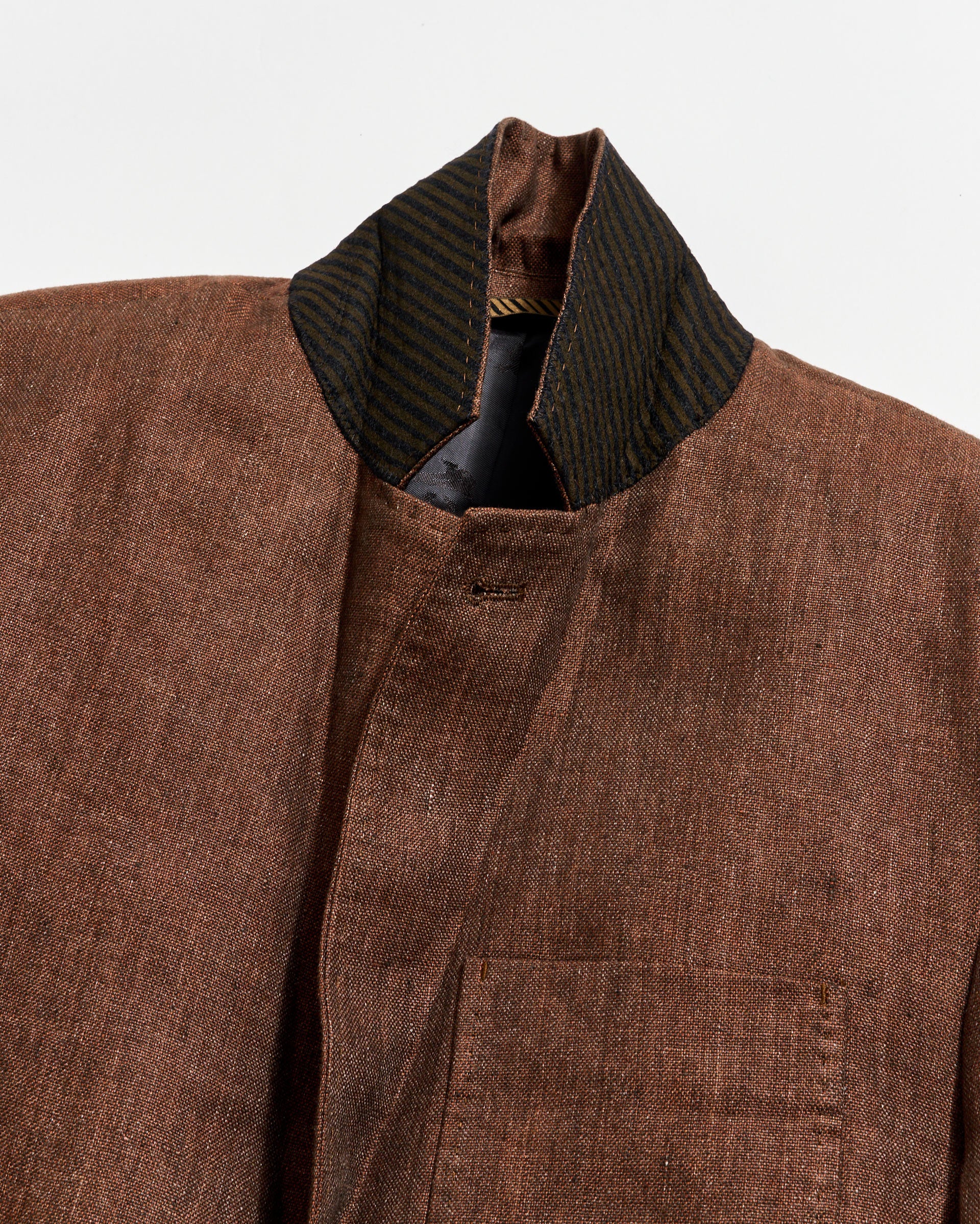 Brown textured jacket with a collar on a white background