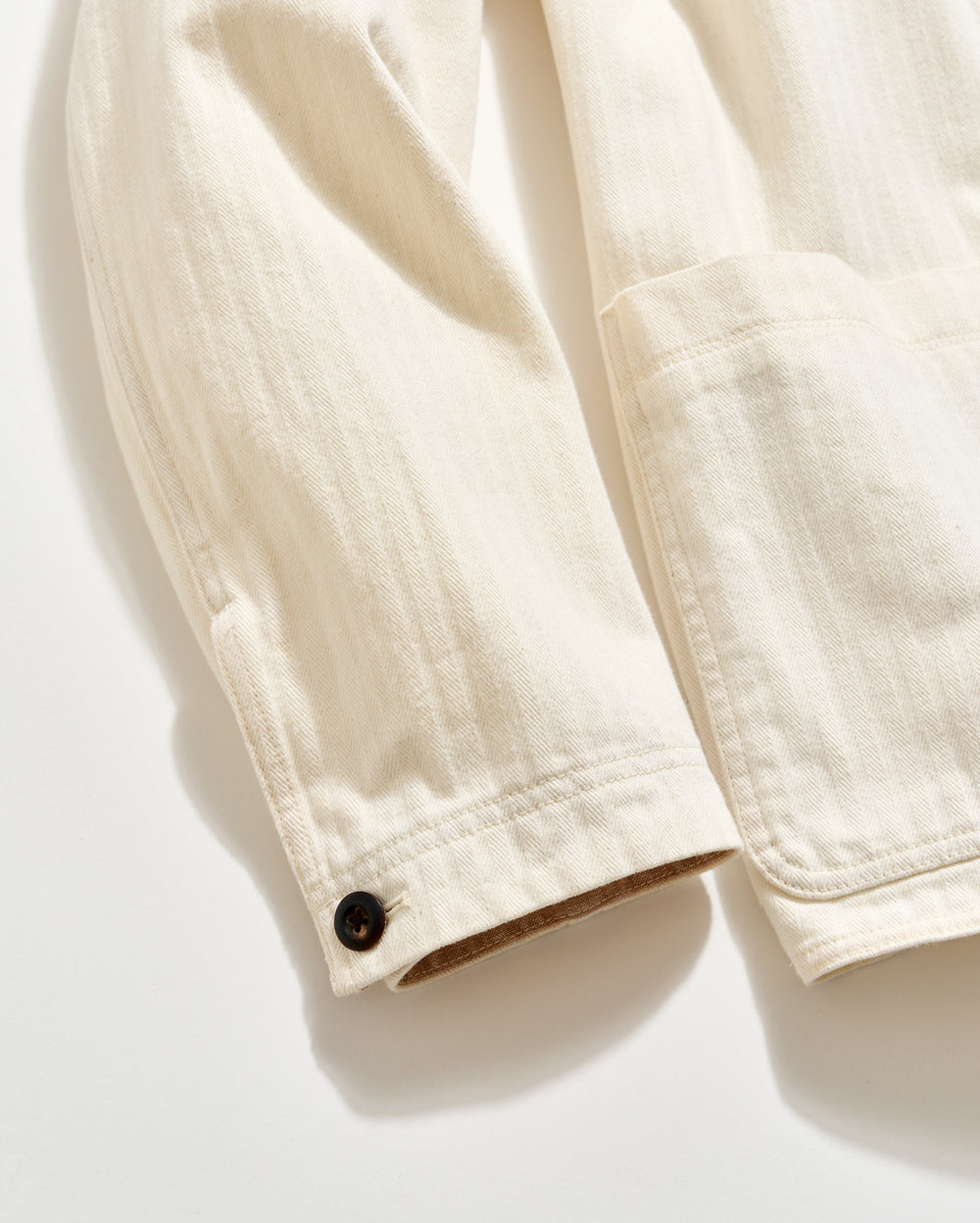 Close-up of a beige jacket on a white background