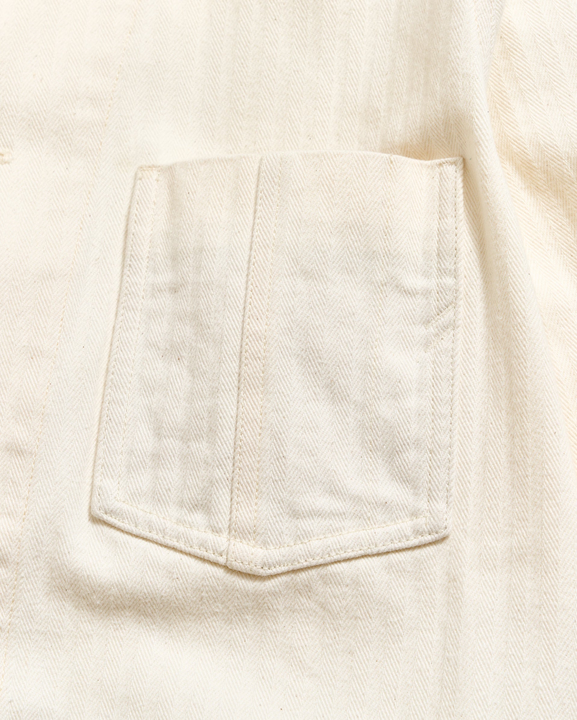 Close-up of a pocket on a light-colored fabric