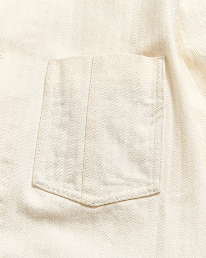Close-up of a pocket on a light-colored fabric