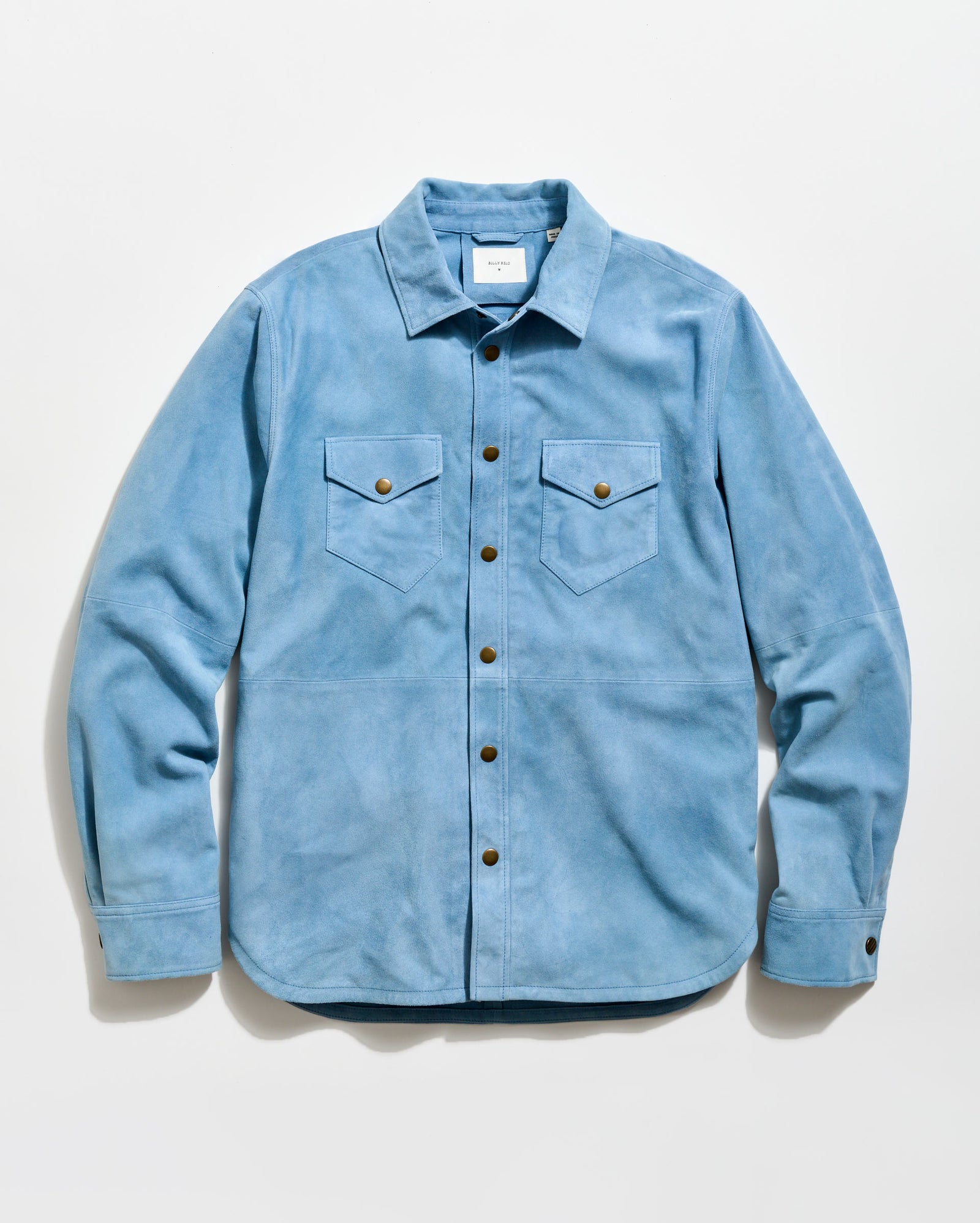 Light blue denim shirt with button details on a white background