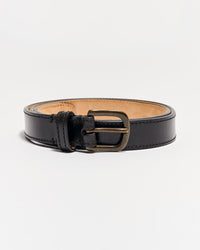 A black leather belt with a brass buckle, rolled up and placed on a white background. The belt has visible stitching along the edges and a tan interior.