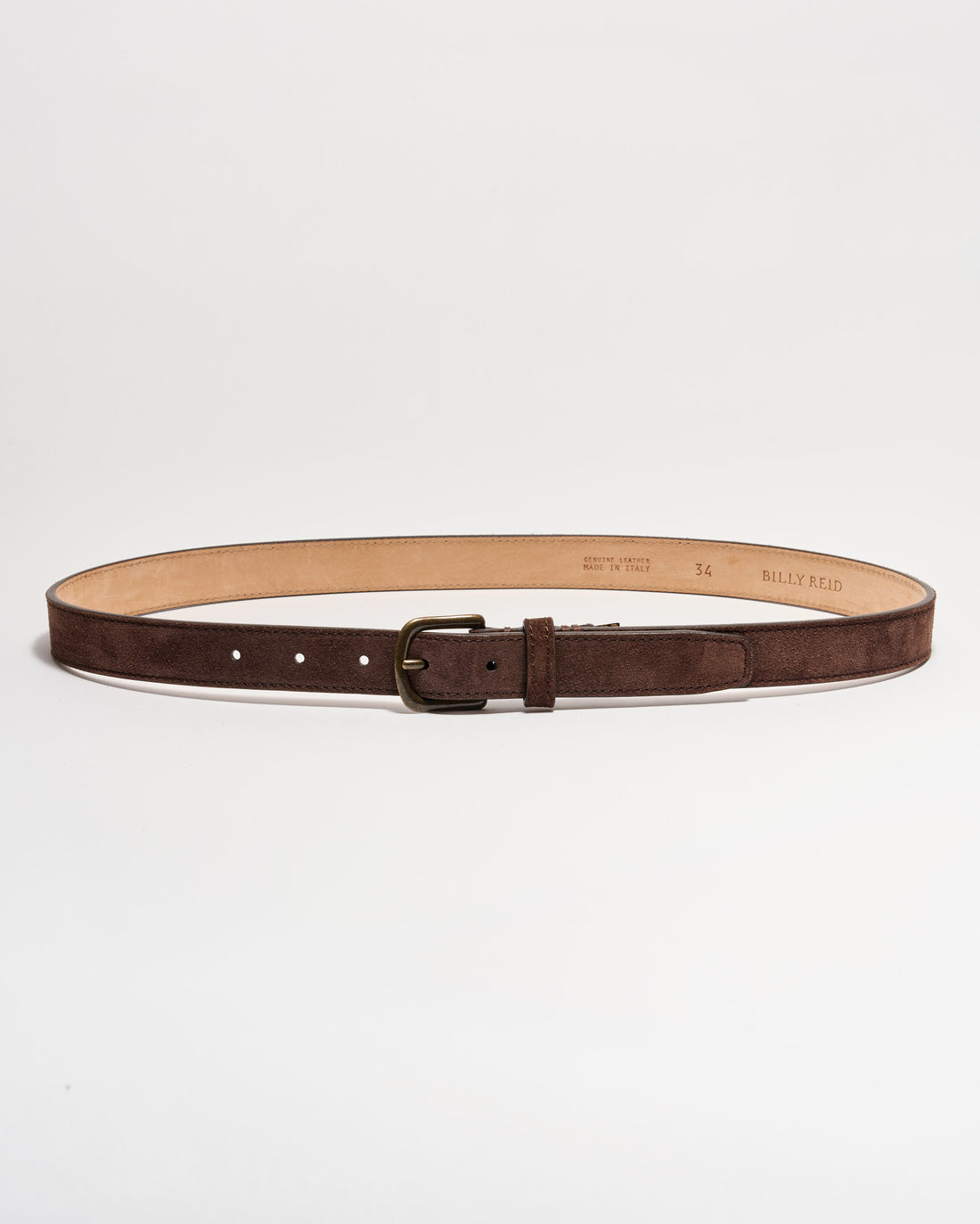 A brown suede leather belt with a brass buckle, laid flat in a circular shape on a white background. The interior of the belt is tan, and several adjustment holes are visible.