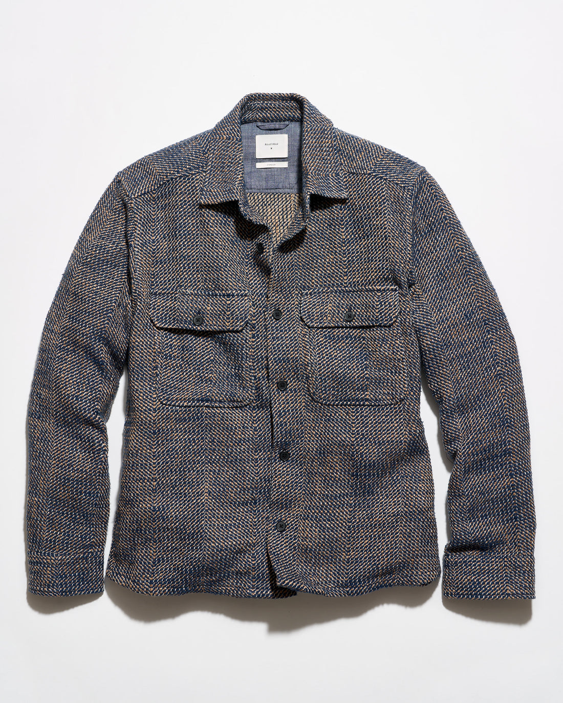 Blue and brown overshirt on a grey background.