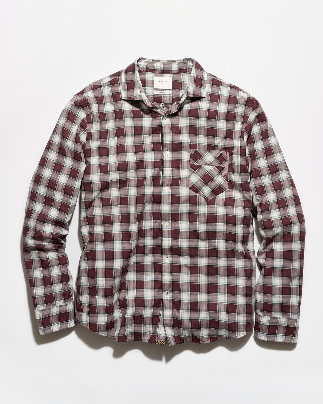 A long-sleeve button-up plaid shirt in a burgundy, white, and gray checkered pattern, featuring a single chest pocket, laid flat against a light gray background.