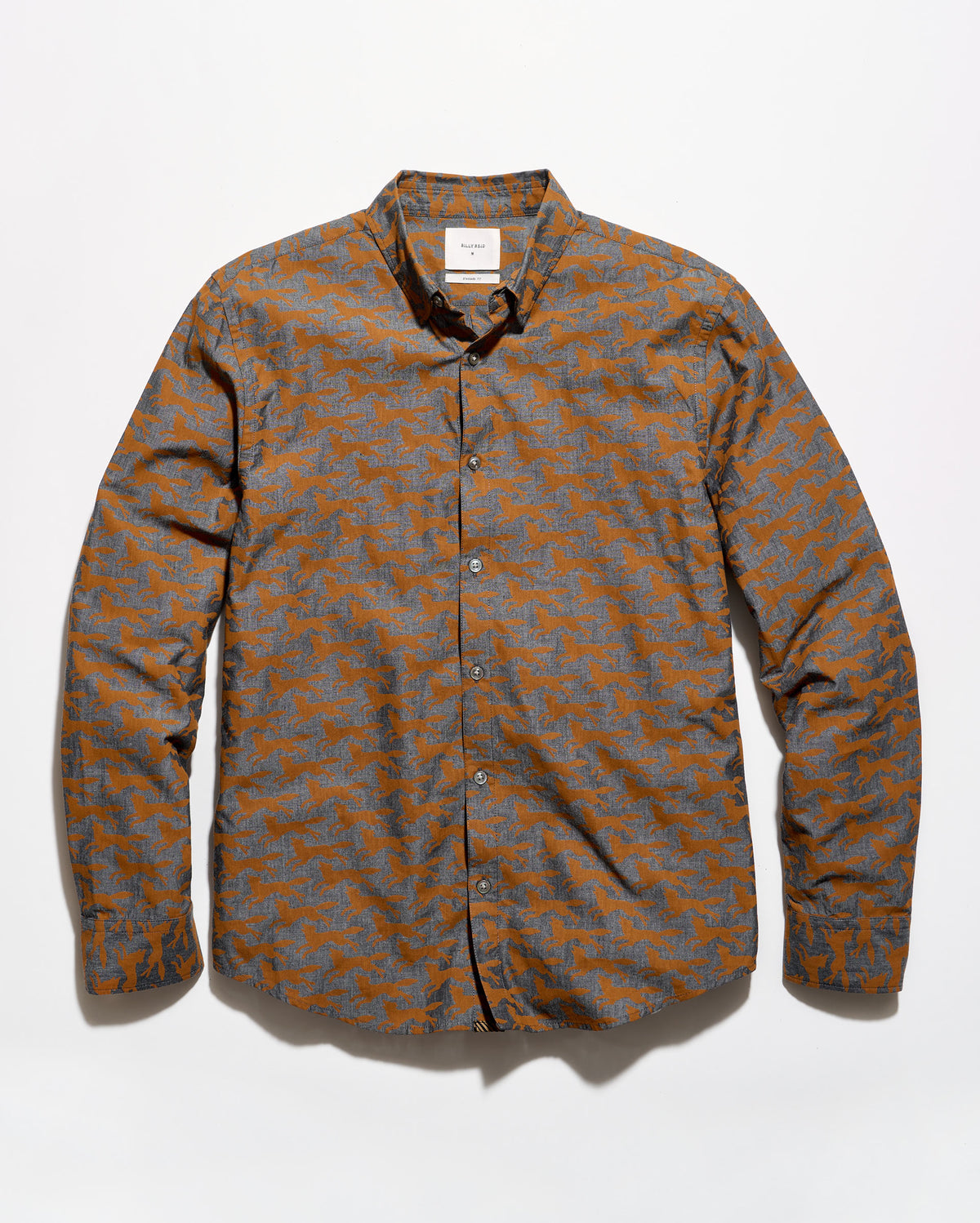 A long-sleeve button-up shirt with an abstract geometric pattern in orange and gray, laid flat against a white background.