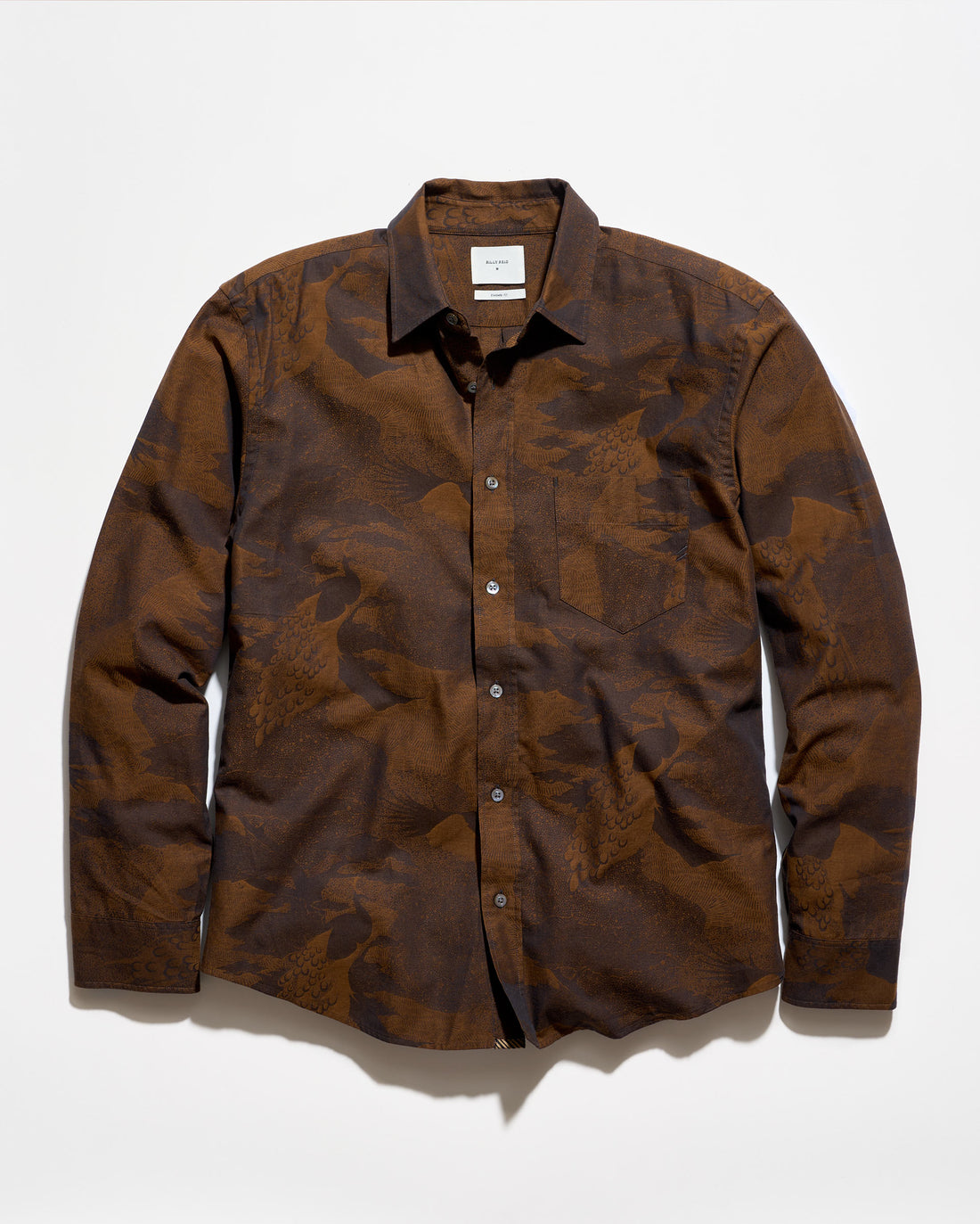 A long-sleeve button-up shirt with a brown and dark brown abstract camouflage pattern, laid flat against a white background.