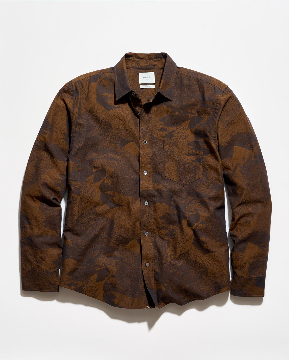 A long-sleeve button-up shirt with a brown and dark brown abstract camouflage pattern, laid flat against a white background.