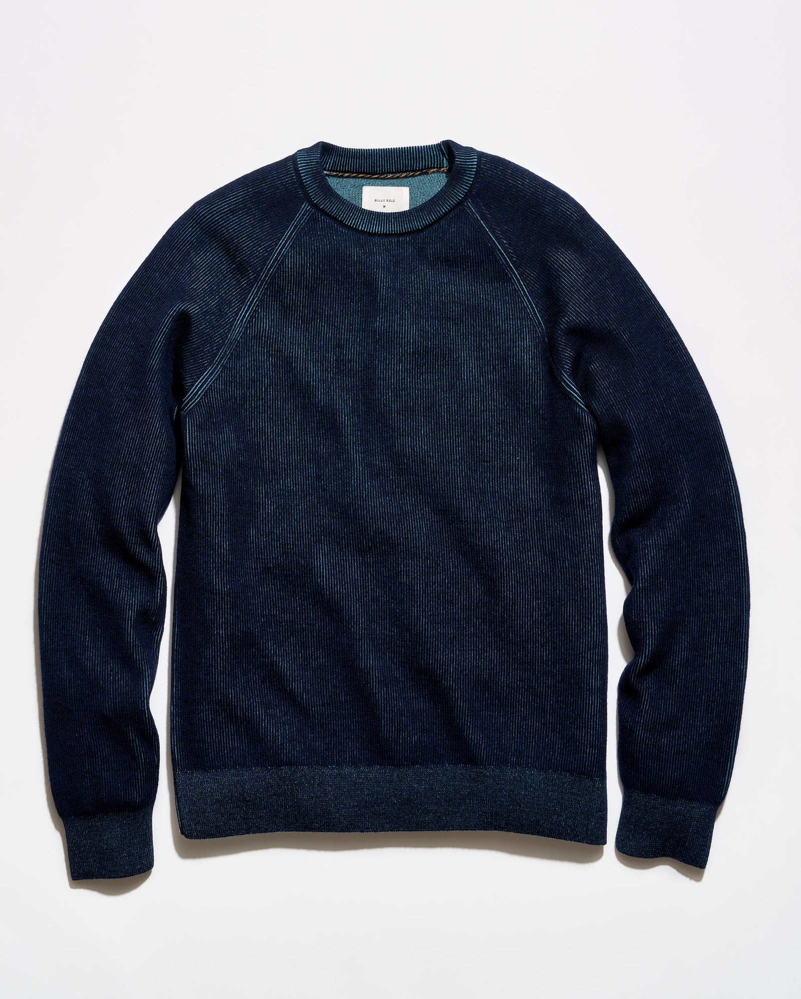 A dark navy blue crewneck sweater with raglan sleeves, laid flat against a clean white background.