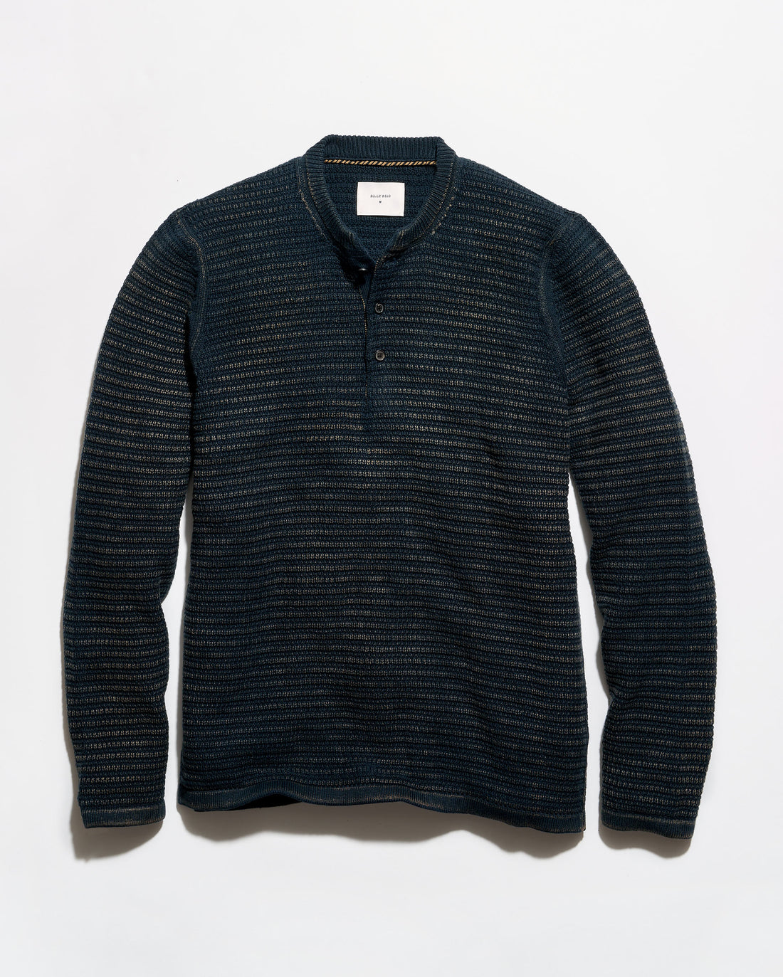 A dark navy blue long-sleeve henley shirt with a textured, fine horizontal stripe pattern, laid flat against a light gray background.