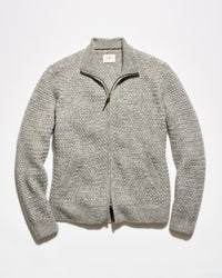 A light gray textured knit zip-up sweater with a mock neck collar, laid flat against a white background.