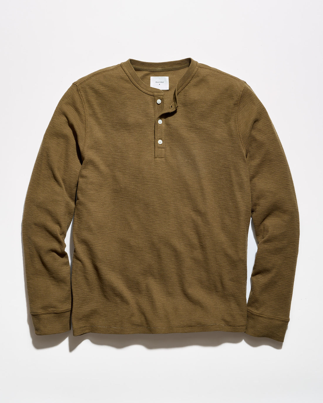 A brown long-sleeve henley shirt with a three-button placket, laid flat against a light gray background.