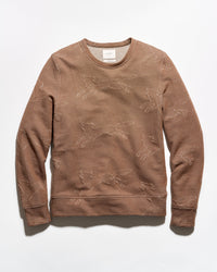 A brown crewneck sweatshirt with a textured, distressed knit fox pattern, laid flat against a white background.
