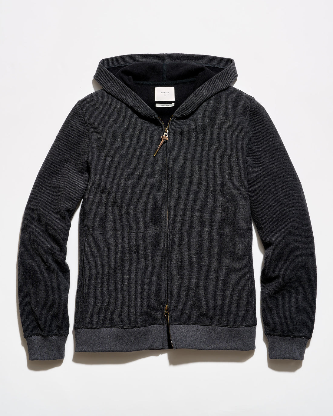 A dark gray heather zip-up hoodie with a black interior hood lining and contrasting dark gray ribbed cuffs and hem, shown flat on a light gray background.