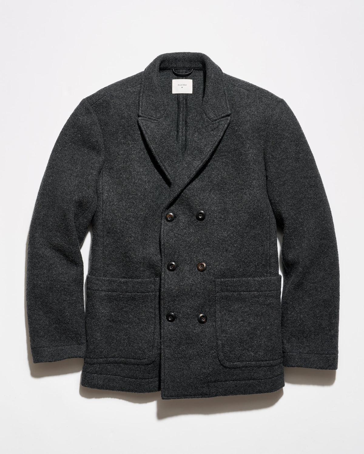 A dark charcoal gray double-breasted wool-blend jacket with notch lapels, dark buttons, and front patch pockets, displayed flat against a light gray background.