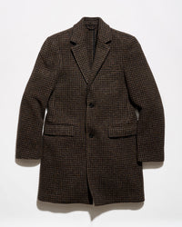 A dark brown and black houndstooth patterned blazer jacket, displayed flat against a plain white background.
