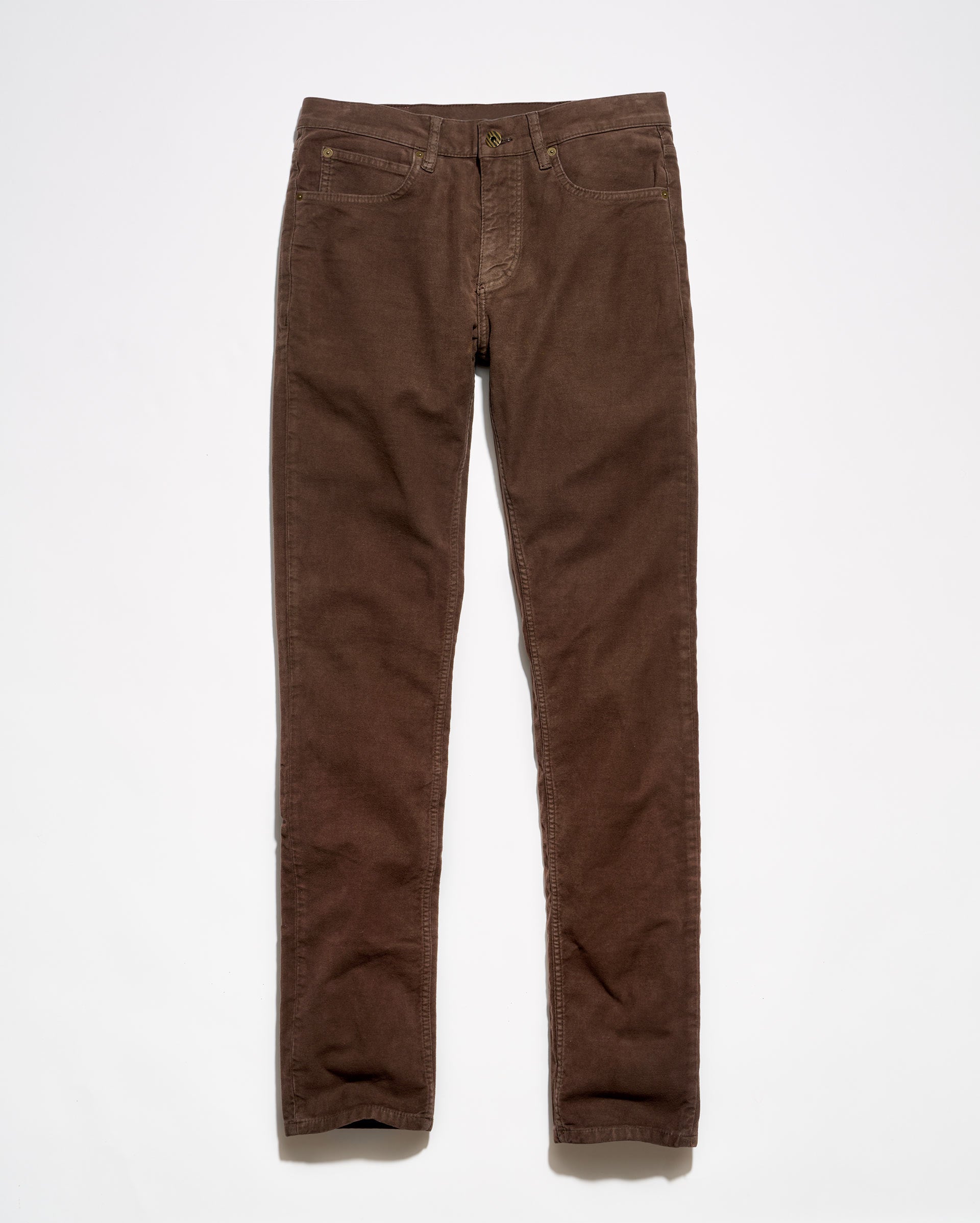 A pair of brown moleskin jeans laid flat against a clean white background.