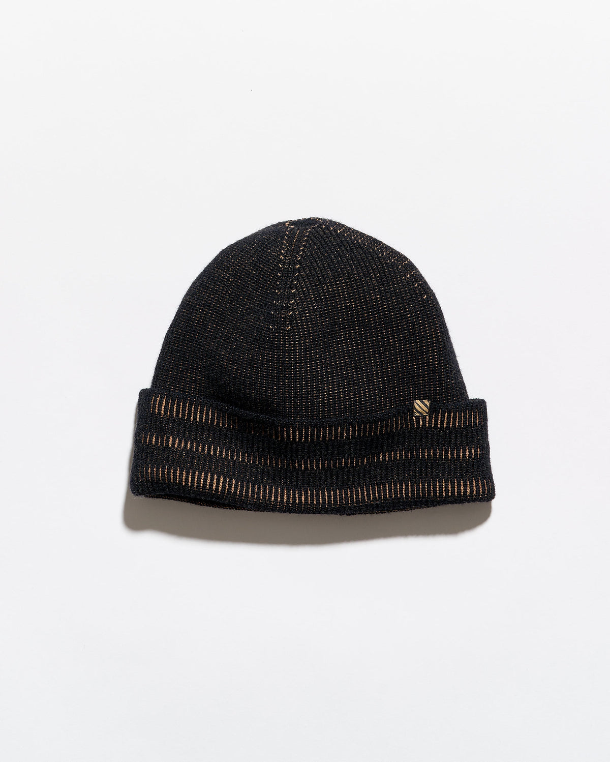 Black beanie on a light gray background
