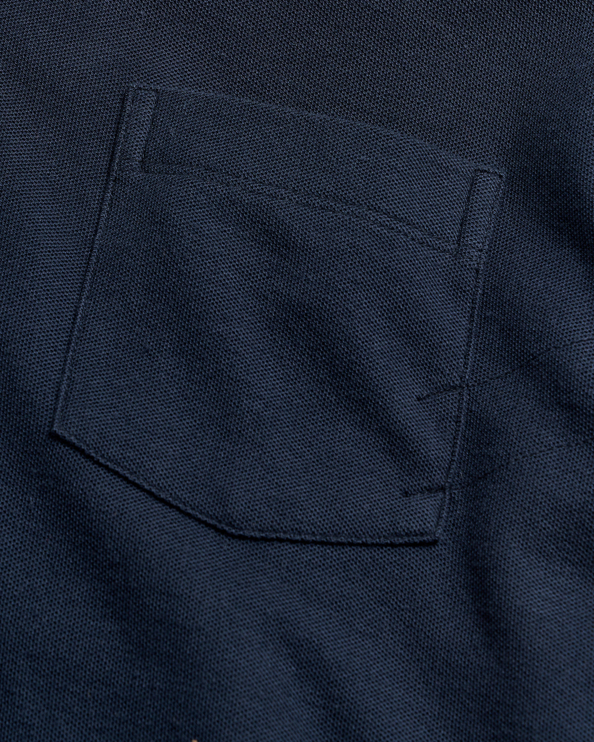 Close-up of a navy blue pocket on a garment