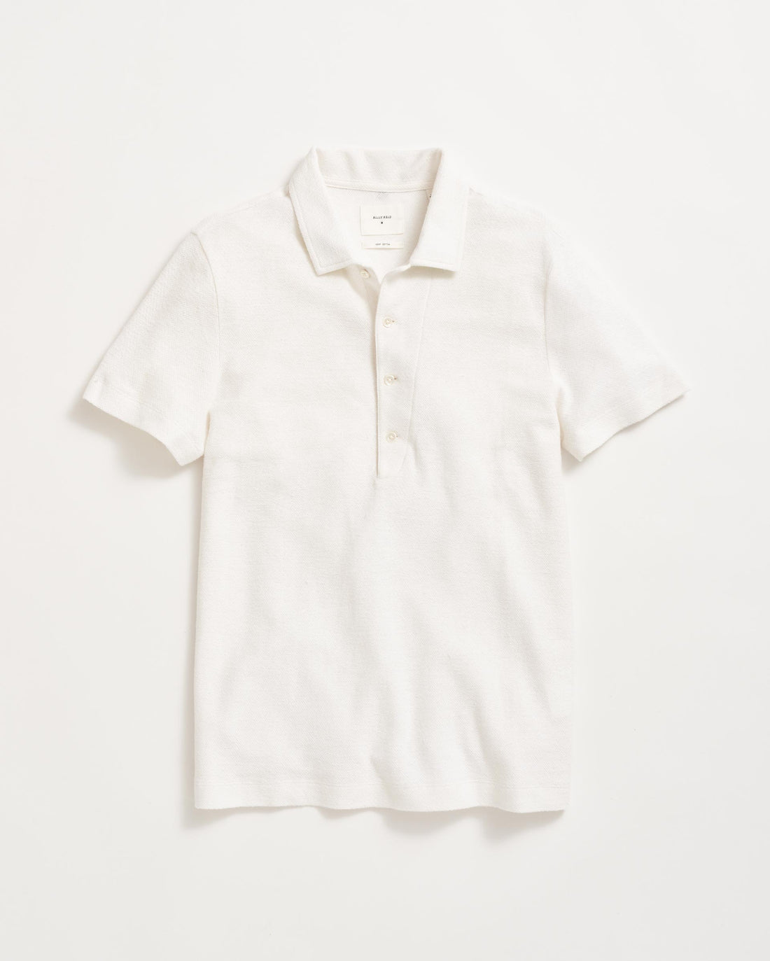 A plain white short-sleeve polo shirt with a collar and three buttons, laid flat on a white background.