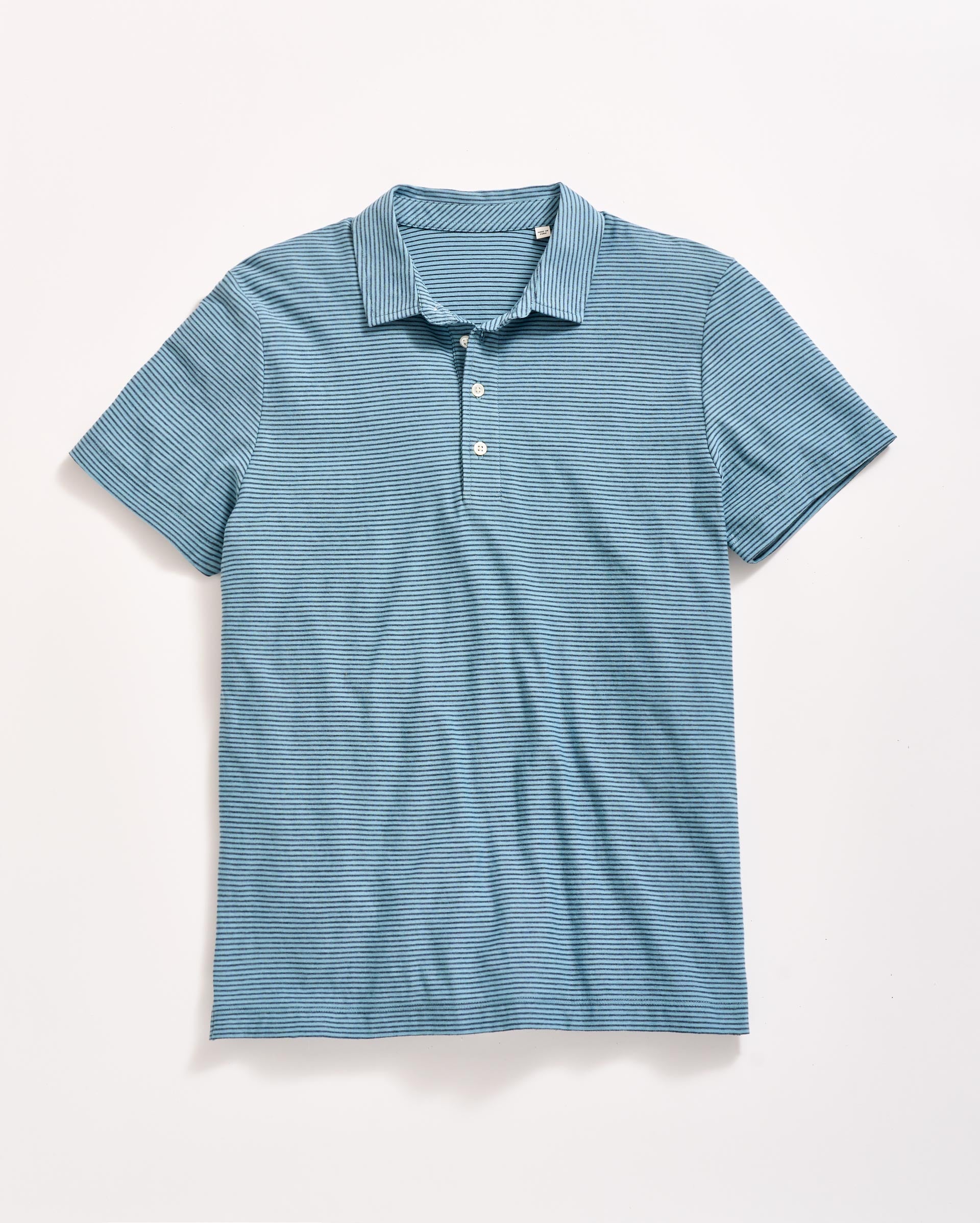 Blue short-sleeve polo shirt with thin white horizontal stripes, buttoned collar, and a casual fit, laid flat on a white background.