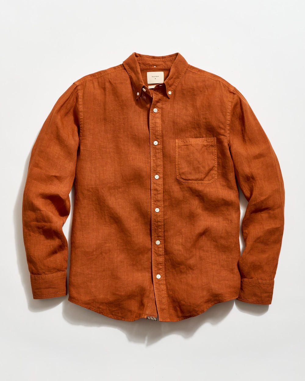 Brown button-up shirt on a white background