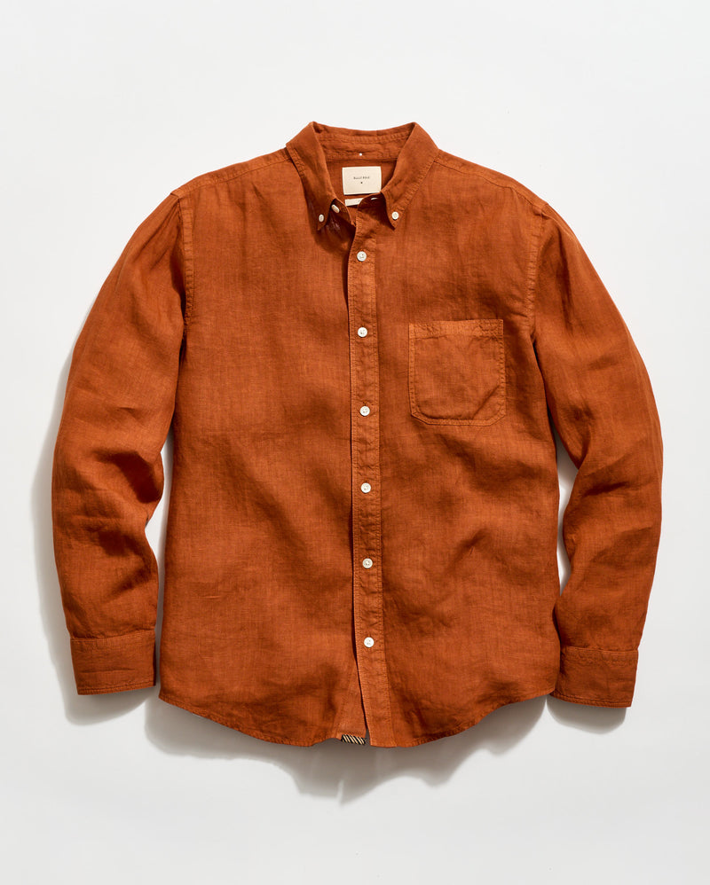 Brown button-up shirt on a white background