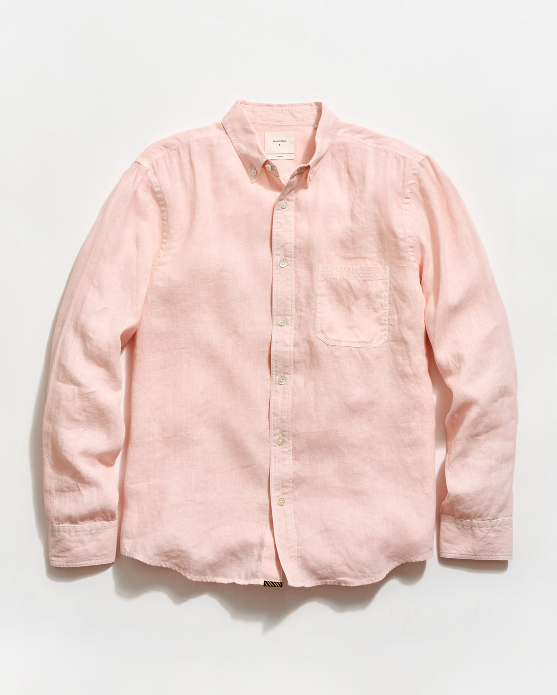 Pink button-up shirt on a light gray background