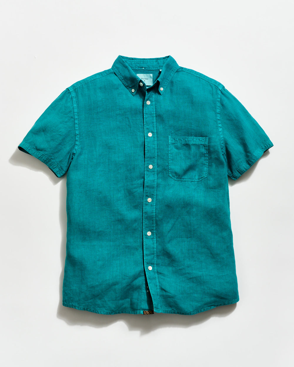 Teal short-sleeve shirt on a white background