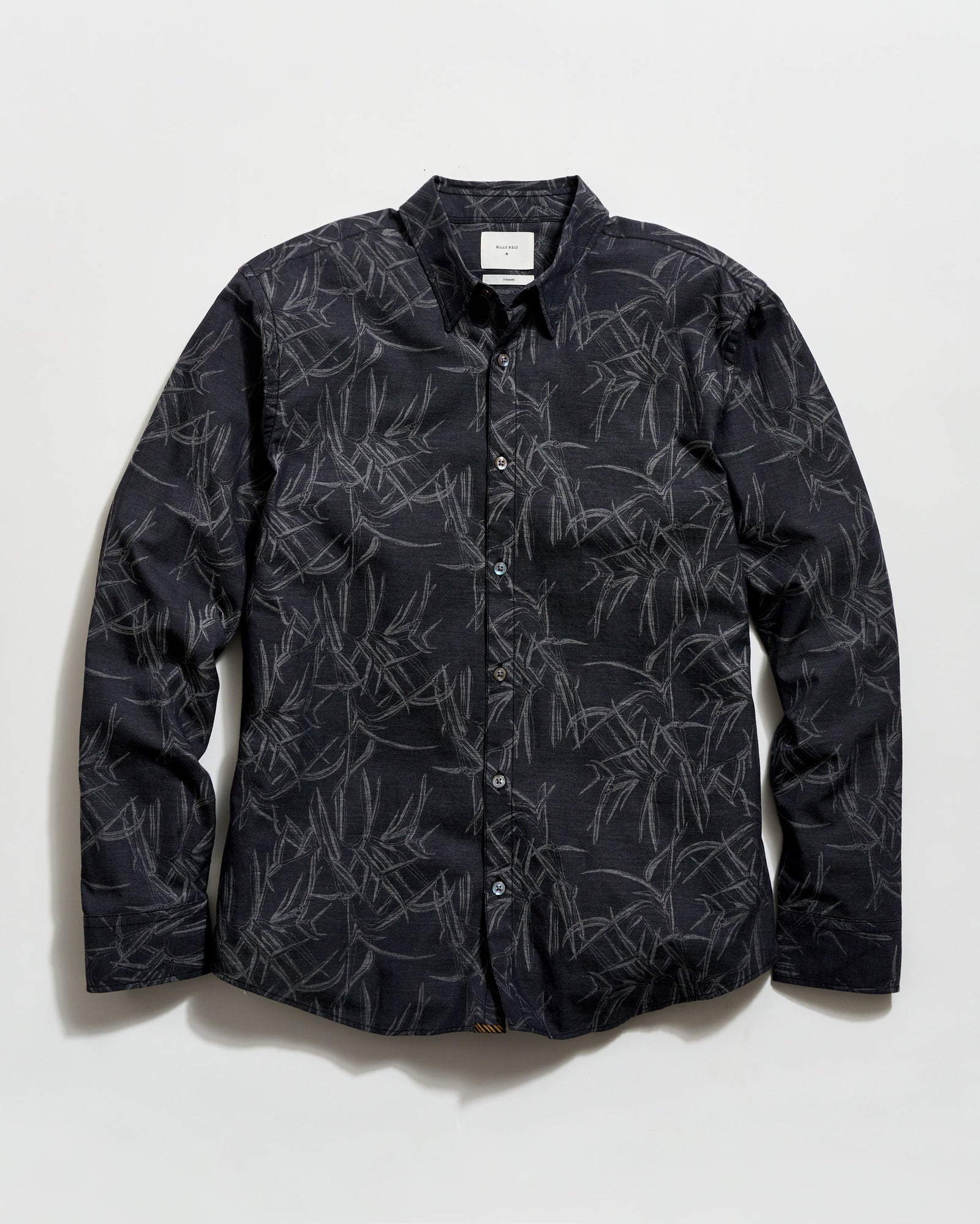 Black patterned shirt on a white background