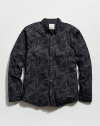 Black patterned shirt on a white background