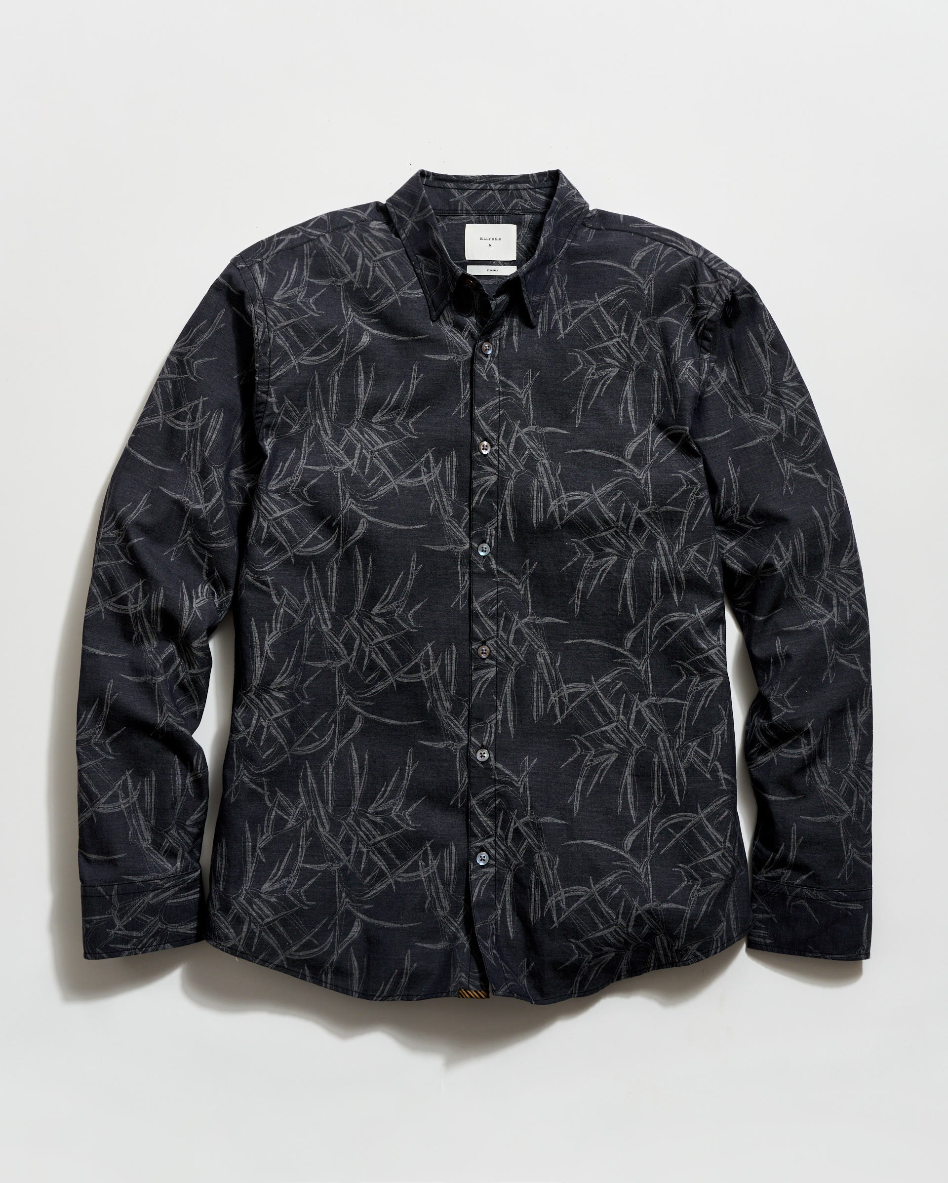 Black patterned shirt on a white background