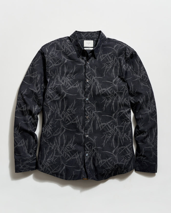 Black patterned shirt on a white background