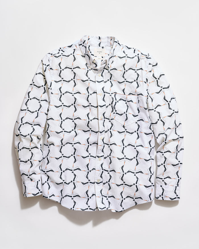White shirt with black geometric pattern on a white background