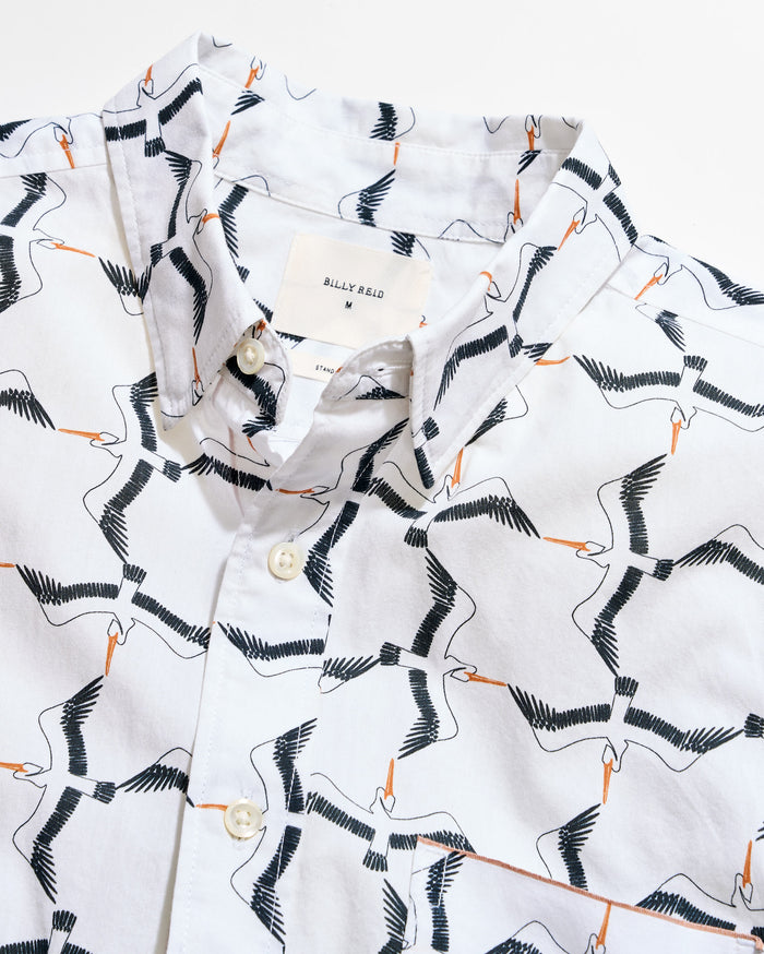 Shirt with bird pattern on a white background
