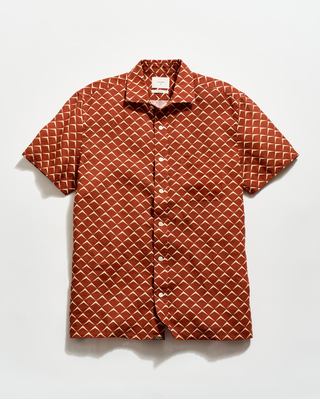 Short-sleeve shirt with geometric pattern on a white background