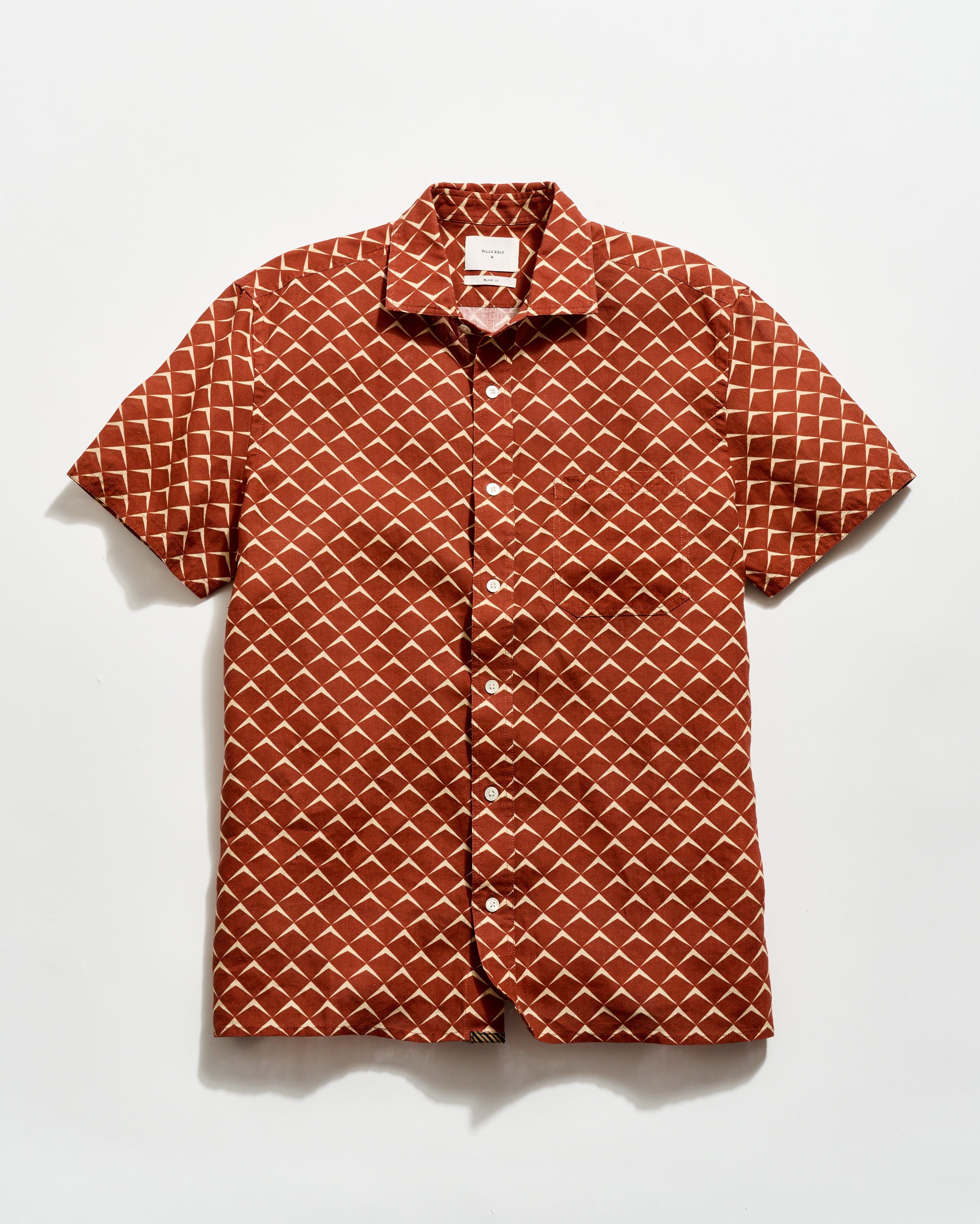 Short-sleeve shirt with geometric pattern on a white background