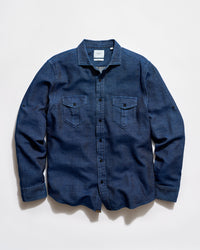 Blue denim shirt on a light gray background