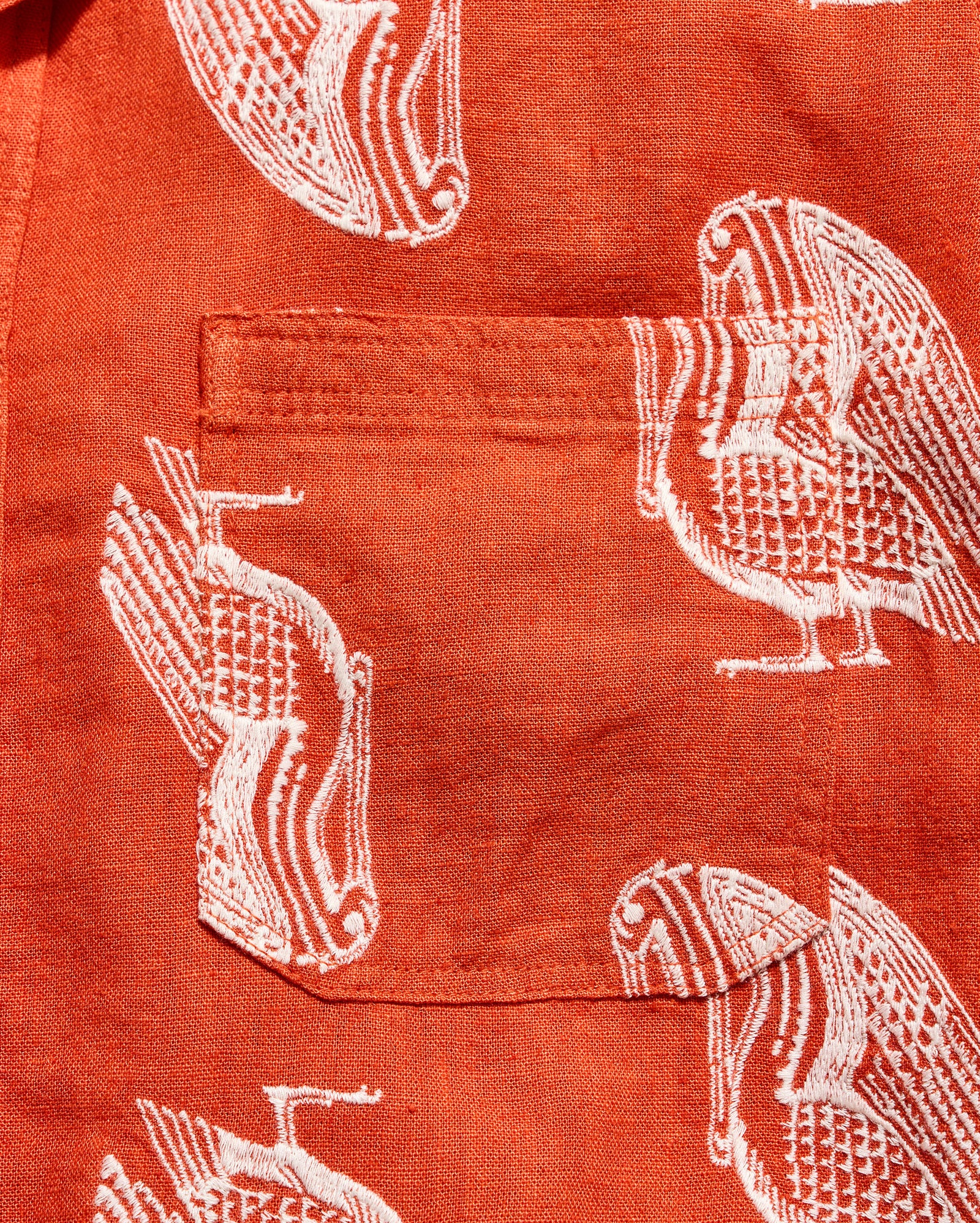 Red shirt with white bird pattern